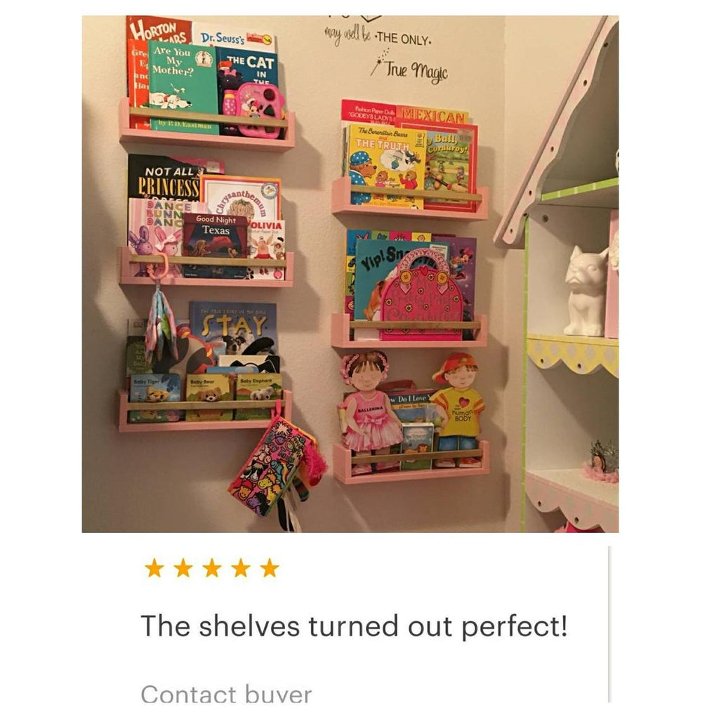 blush pink shelves gold bars wall book shelves