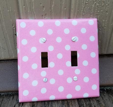 Pink with White Polka Dots Light Switch on rustic background