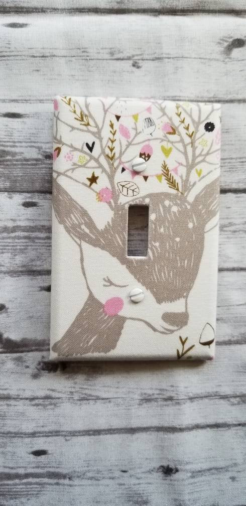 Deer Light Switch Cover on rustic wall