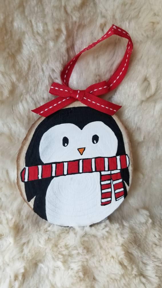 Custom Penguin Baby's First Christmas Ornament with red ribbon hanger